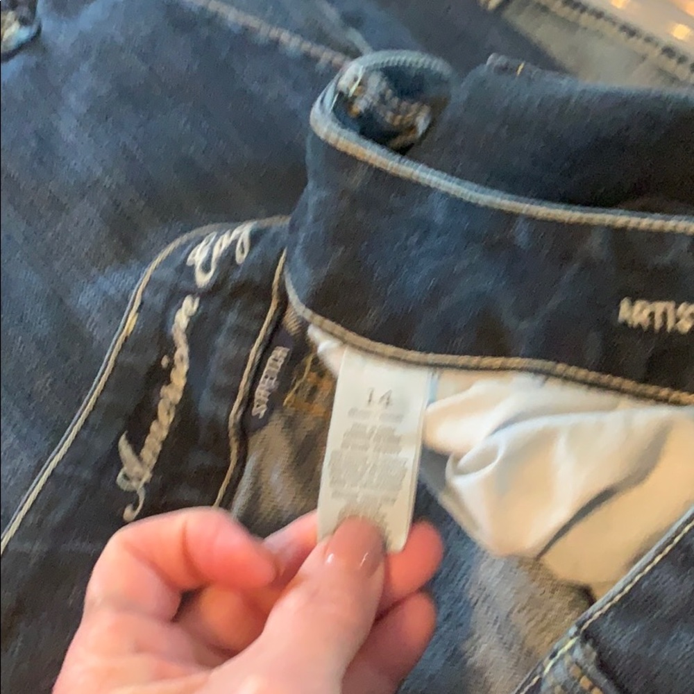 Dark AE jeans.